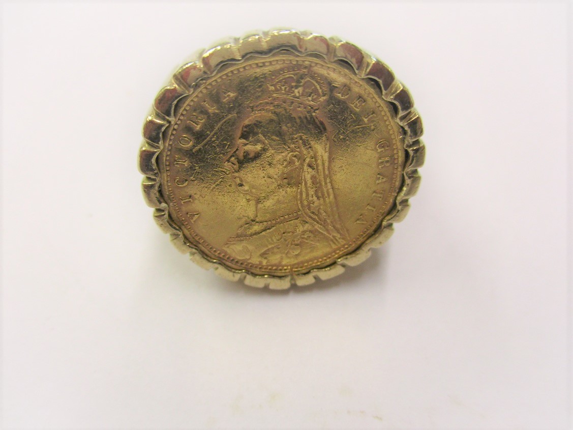 An 1892 gold half sovereign having Jubilee head and shield back set in a 9ct gold ring, approx total