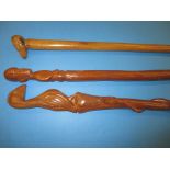 3 African carved wood walking sticks