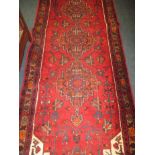 A vintage hand woven wool rug, approx size 107x310cm