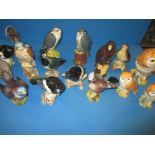 A quantity of vintage Beswick birds and spirit bottles