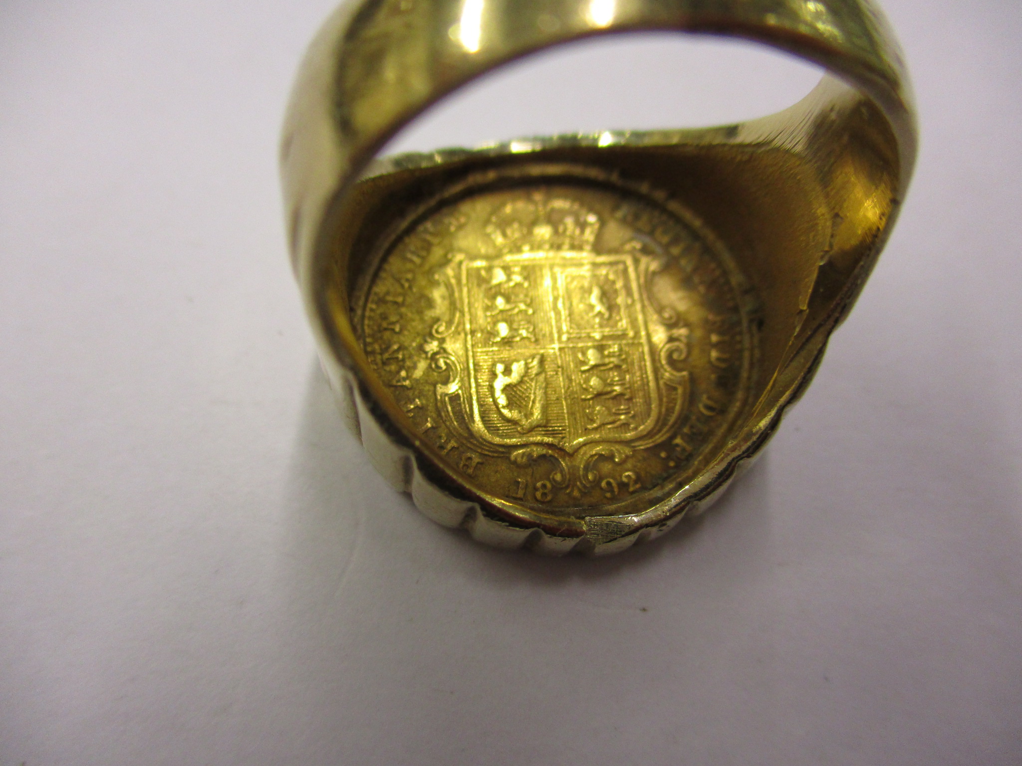 An 1892 gold half sovereign having Jubilee head and shield back set in a 9ct gold ring, approx total - Image 5 of 10