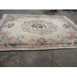 A large wool rug, approx size 9ft x 12ft