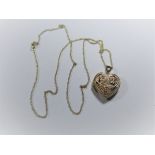 A 9ct gold necklace with heart pendant, approx. weight 2.4g