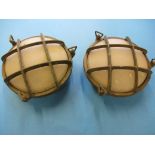 A pair of brass bulkhead lamp bodies