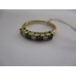An 18ct yellow gold diamond and emerald ring, approx. ring size P1/2