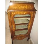 A vintage inlaid floor standing collectors glass fronted display cabinet