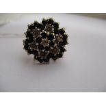 A 9ct gold diamond and sapphire cluster ring, approx. ring size L1/2