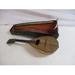 An antique mandolin in hard case