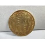 A Victorian gold half sovereign dated 1892.