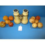 A quantity of 19th century ivory billiard balls and a pair of ivory binoculars