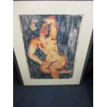 A large framed lithograph of a nude female.