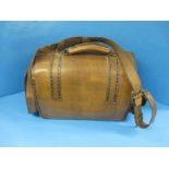 A vintage leather shooting cartridge accessory bag .