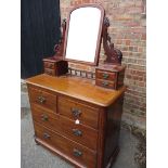 A mahogany chest of drawers with dressing table top