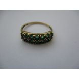 A 9ct gold diamond and emerald ring, approx. ring size P