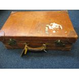 A vintage leather travel case with original railway labels