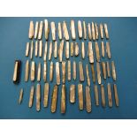 A large collection of antique and later mother of pearl handled pocked knives