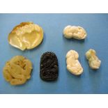 A quantity of oriental carved stone items to include pendants