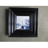 An antique Delft Tile in frame mount.