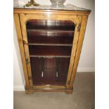 An Edwardian glazed fronted music cabinet