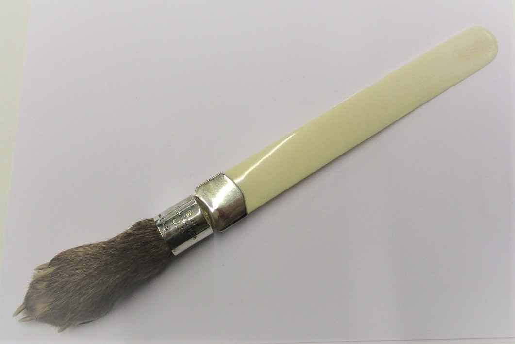 A 1930s ivory page turner with silver mount