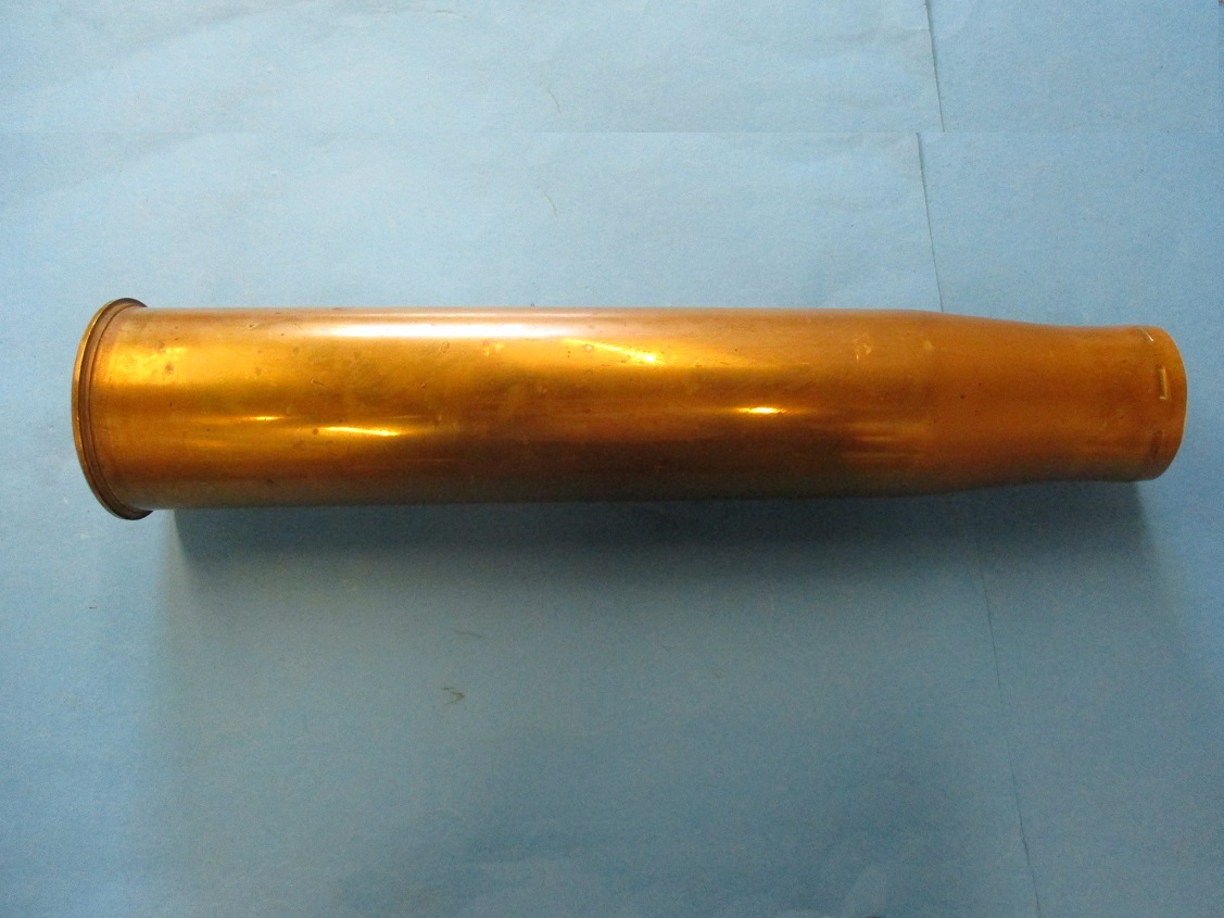 A large WWII 90mm brass shell case dated 1944