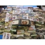 An Edwardian postcard album with approx. 100 cards