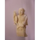 An early 20th century ivory netsuke signed to back
