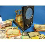 A late 19th century stereoscopic viewer and assorted cards