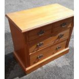 An early 20th century chest of 2 short over 2 long graduated drawers
