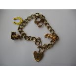 A 9ct gold charm bracelet, approx. weight 25.9g