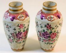 A pair of 19thC. French porcelain vases with hand