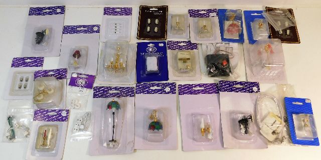 A quantity of mostly sealed dolls house miniature