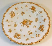 A Meissen porcelain plate with gilded relief decor