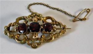 A yellow metal antique brooch set with garnets 6g