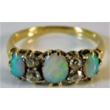 An 18ct gold ring set with opal & diamond 2.6g siz