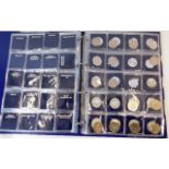 A part album of one £5 coin, £2, 50p & 10p coins