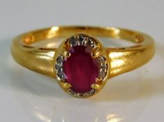 An 18ct gold diamond & ruby ring 3.8g
