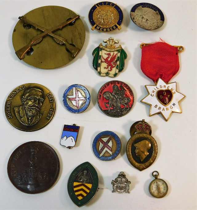 A quantity of mixed badges including rifle club tw