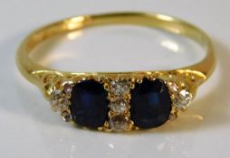 An 18ct gold diamond & sapphire ring 3.4g size T