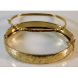 Two 9ct gold bangles with chased decor 20.4g