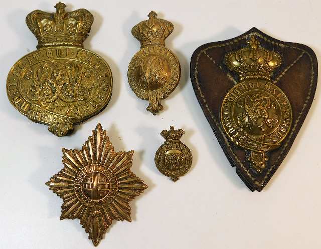 Five brass military badges including 19thC.