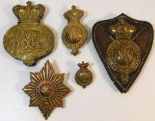 Five brass military badges including 19thC.