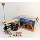 A boxed Mamod steam tractor