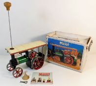 A boxed Mamod steam tractor