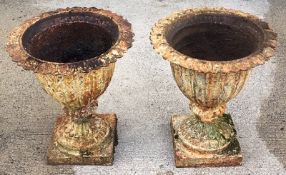 A pair of 19thC. iron garden urns 20in high x 17.5