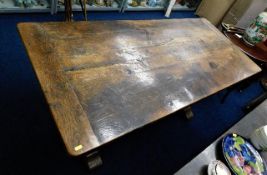 A rustic 19thC. oak country cottage dining table w