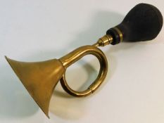 A brass motor car horn