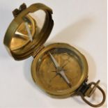 A brass cased military style compass