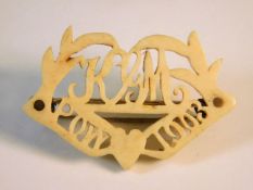 A carved bone POW brooch dated 1903 & initialled K