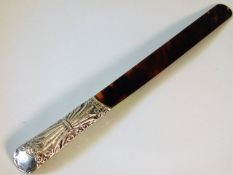 A 19thC. silver mounted tortoiseshell page turner
